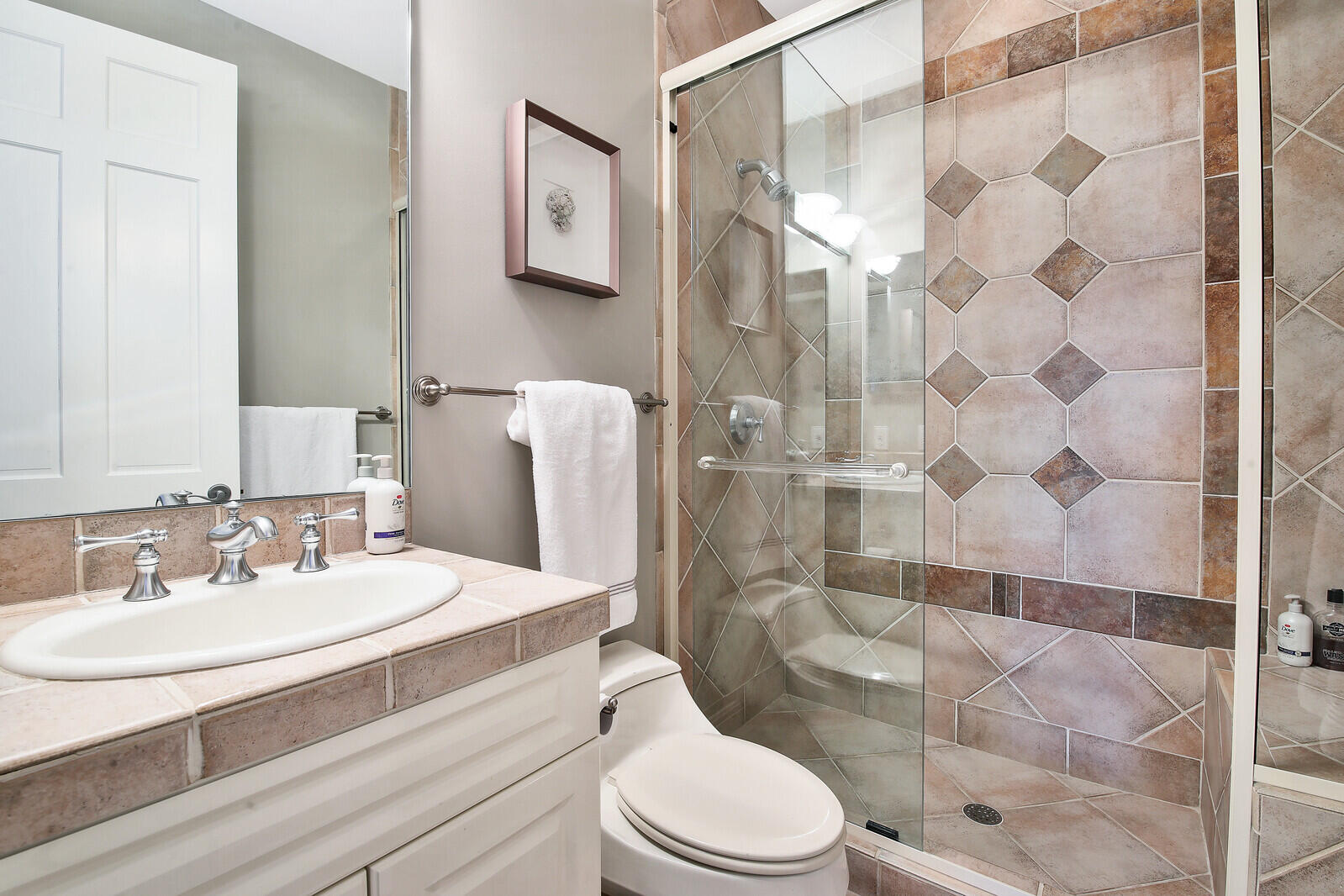 3370 Bridgegate Drive Jupiter, FL 33477 - Photo 26 of 55 a bathroom with a sink toilet and shower
