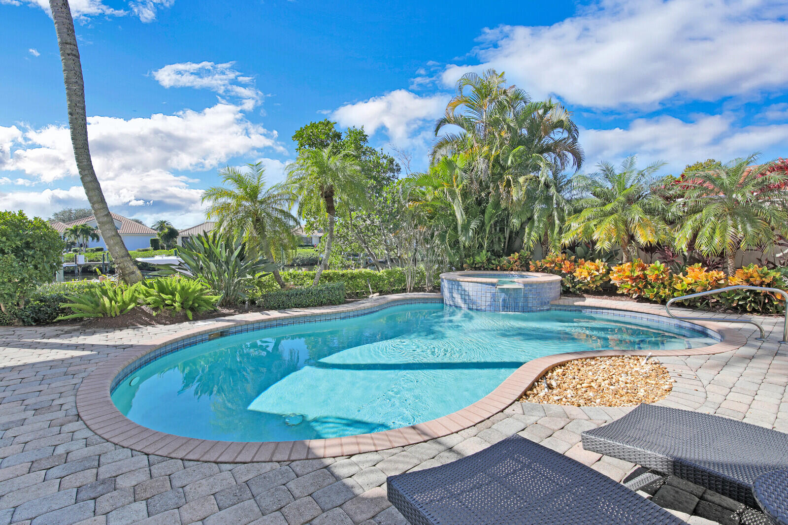 3370 Bridgegate Drive Jupiter, FL 33477 - Photo 43 of 55 a view of a swimming pool with a yard