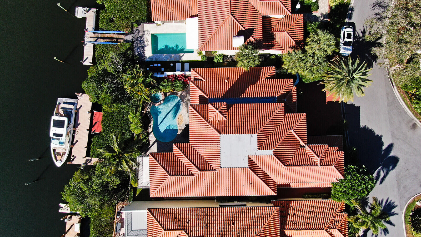 3370 Bridgegate Drive Jupiter, FL 33477 - Photo 51 of 55 an aerial view of multiple houses with yard