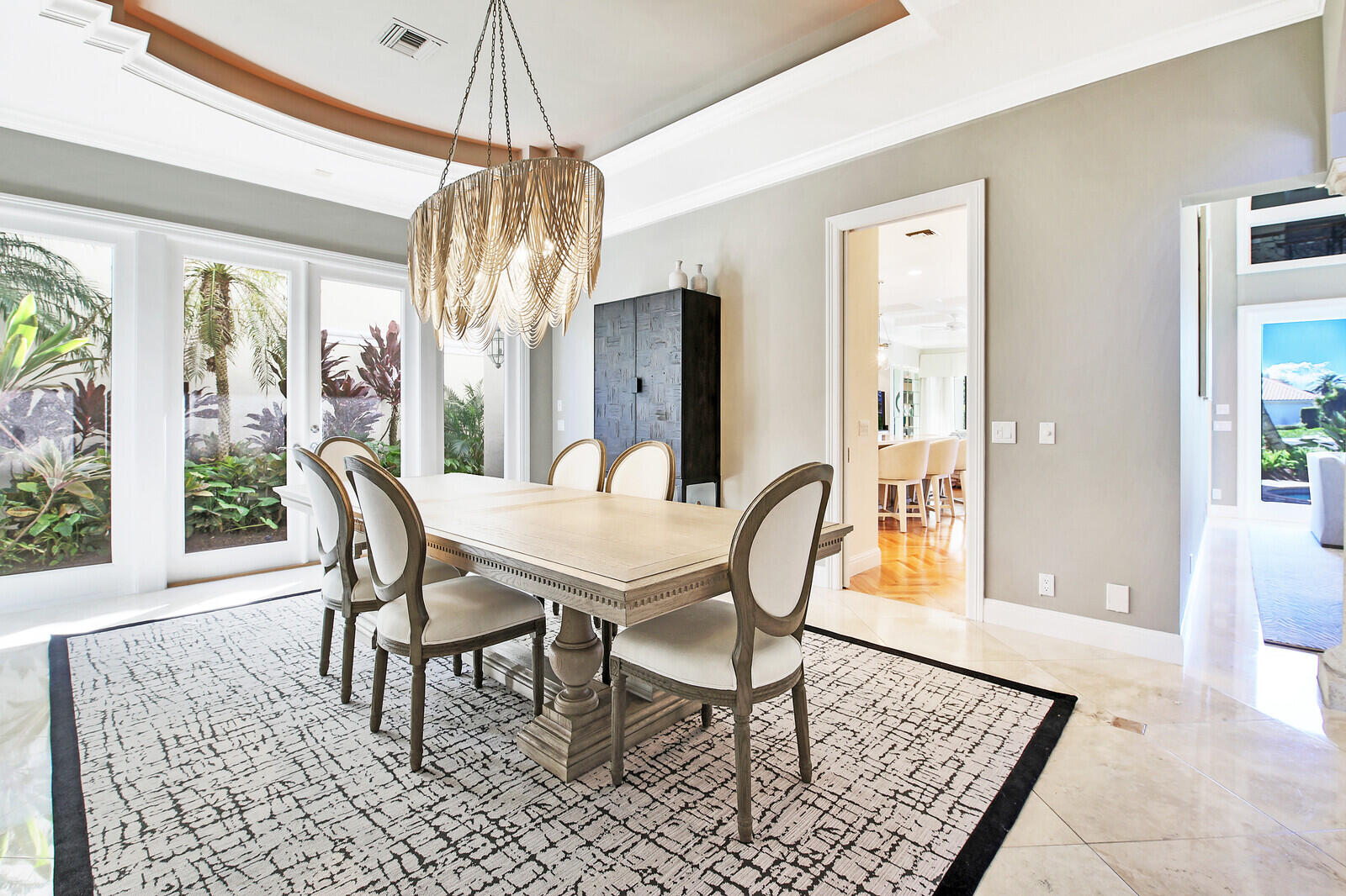 3370 Bridgegate Drive Jupiter, FL 33477 - Photo 8 of 55 a view of a dining room with furniture window and wooden floor