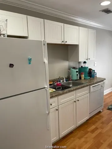 a bedroom with a bed and ceiling fan