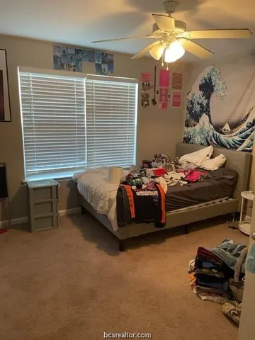 a bed room with a bed and a chandelier