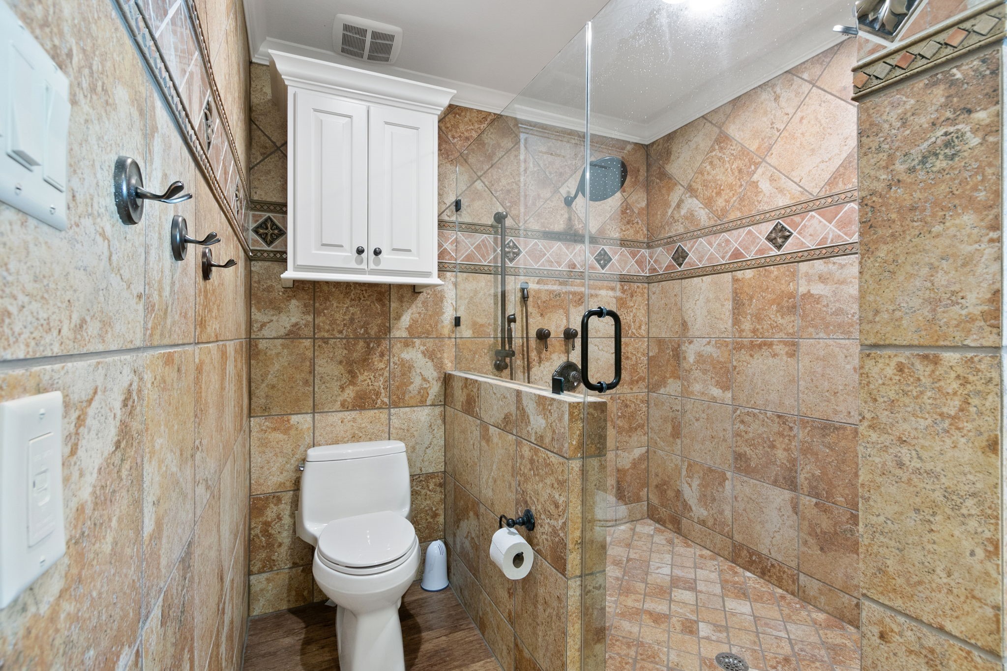 17018 Grant Road Cypress, TX 77429 - Photo 9 of 50 a bathroom with a toilet and a shower