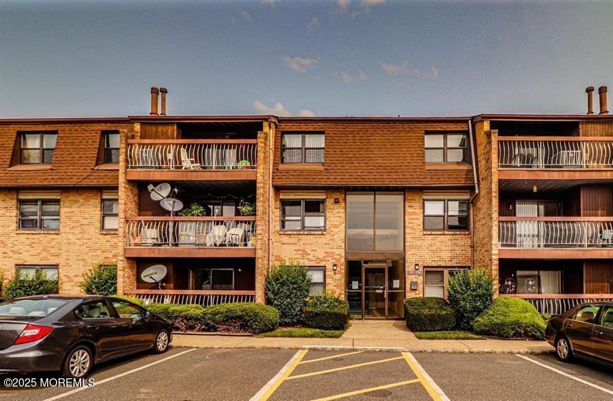 a car parked in front of a big building