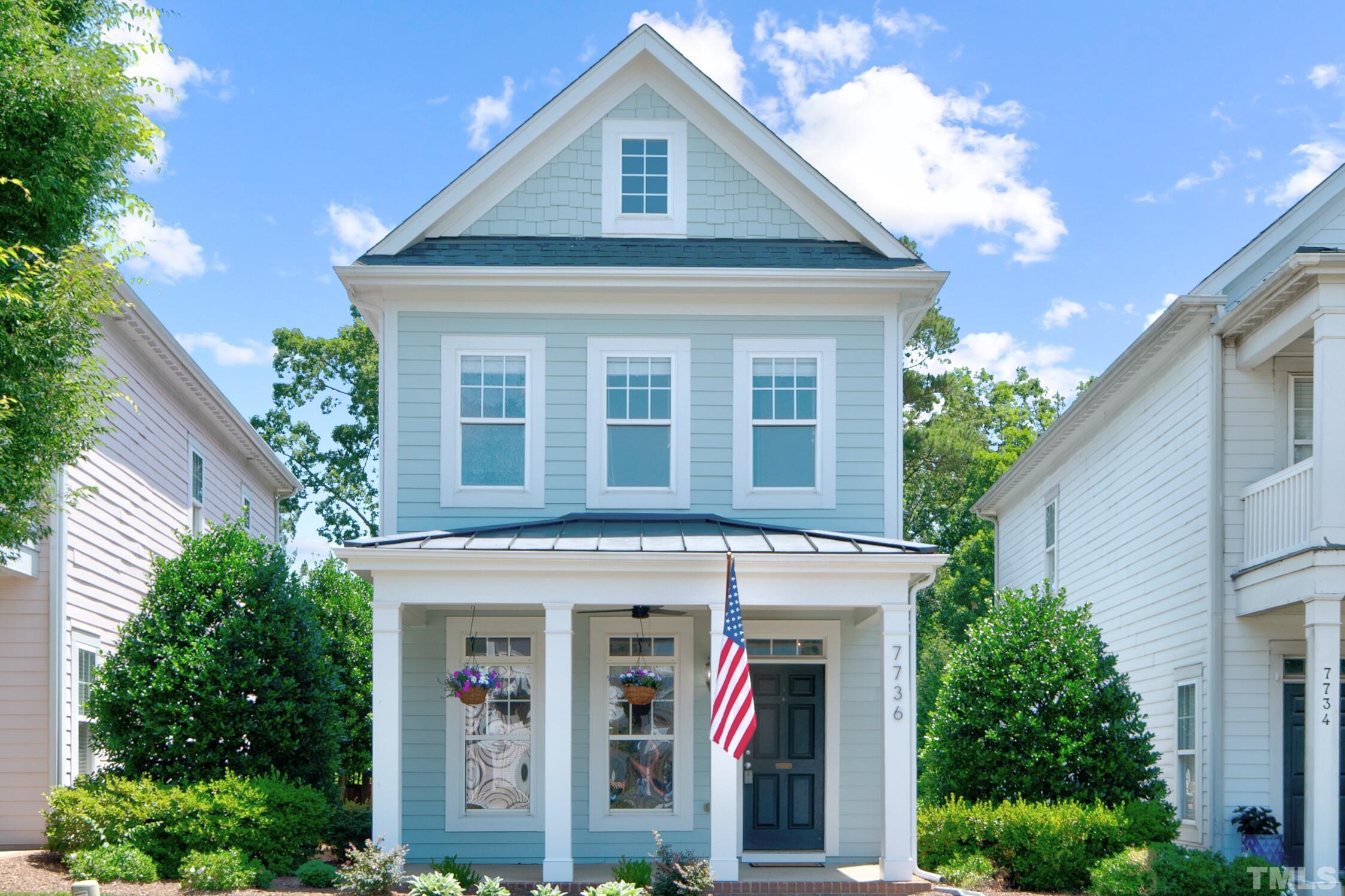 7736 ACC Boulevard Raleigh, NC 27617 - Photo 1 of 37 a front view of a house with plants