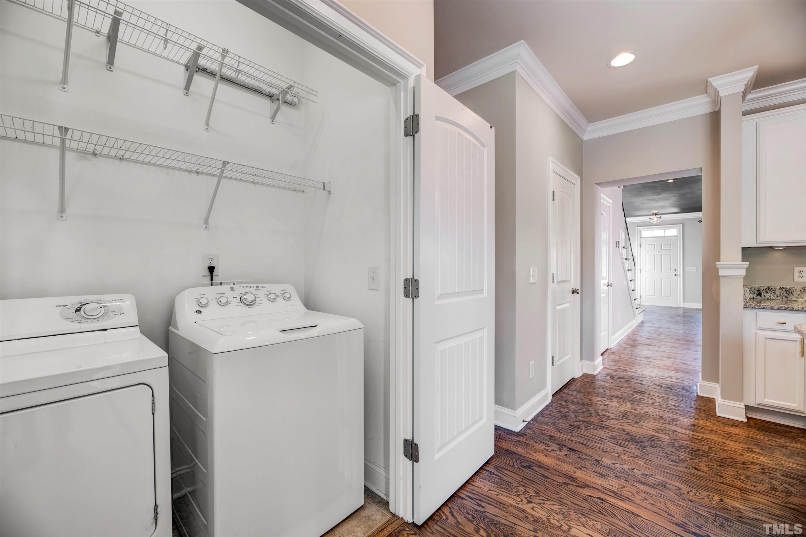 7736 ACC Boulevard Raleigh, NC 27617 - Photo 16 of 37 a view of storage and utility room with a washer dryer