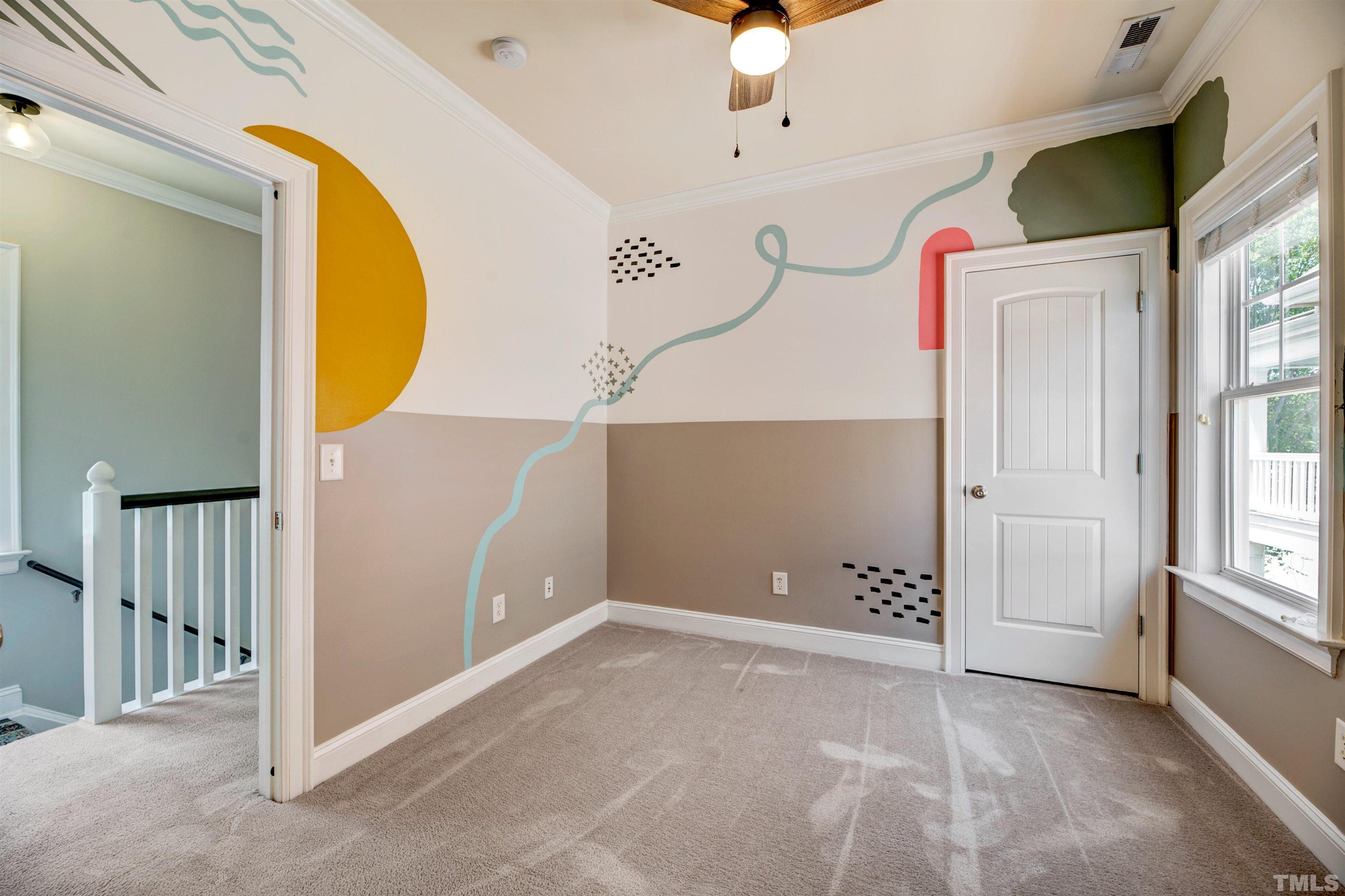 7736 ACC Boulevard Raleigh, NC 27617 - Photo 22 of 37 a view of a room with wooden floor and windows