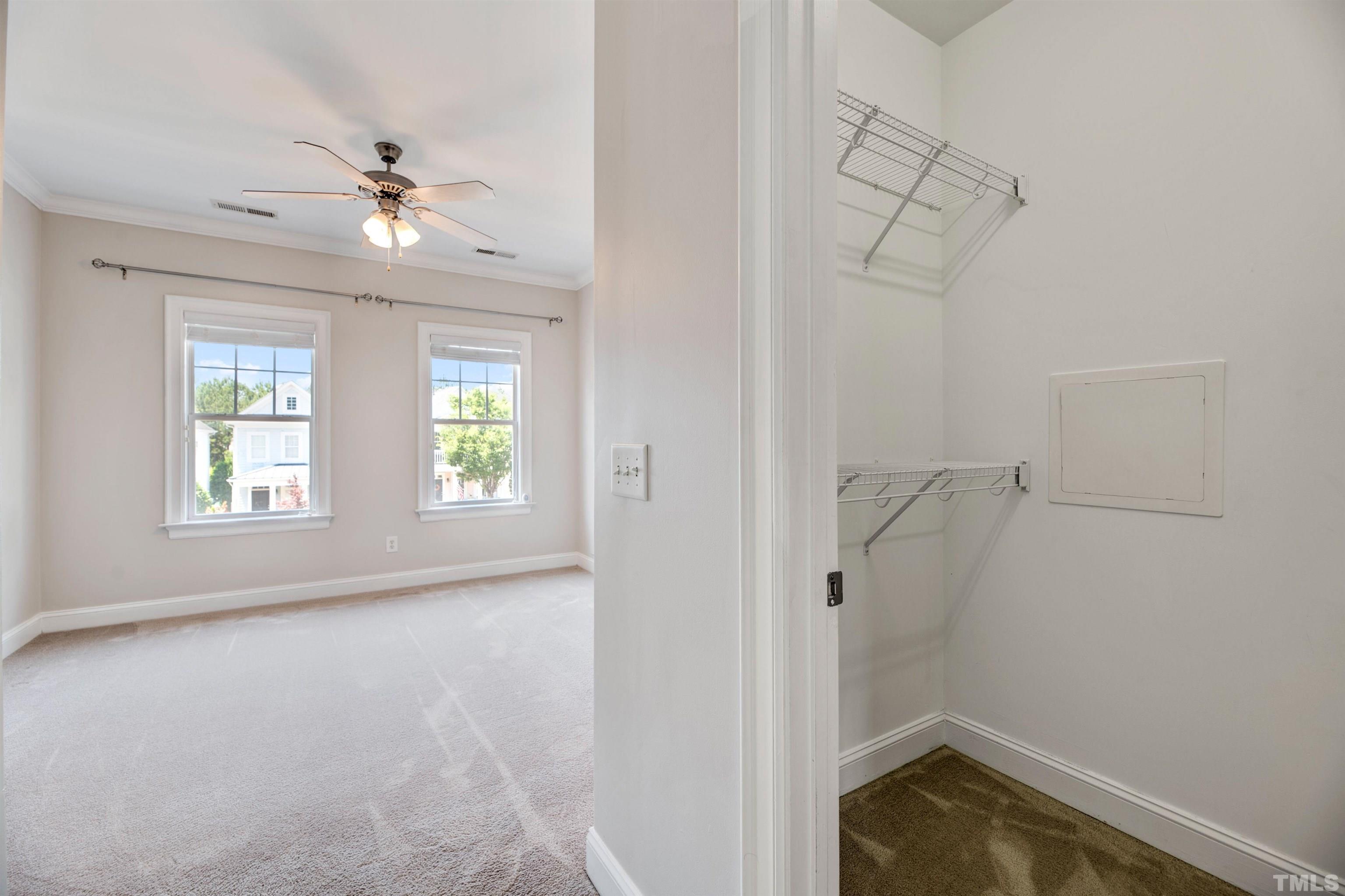 7736 ACC Boulevard Raleigh, NC 27617 - Photo 25 of 37 wooden floor in an empty room with a window