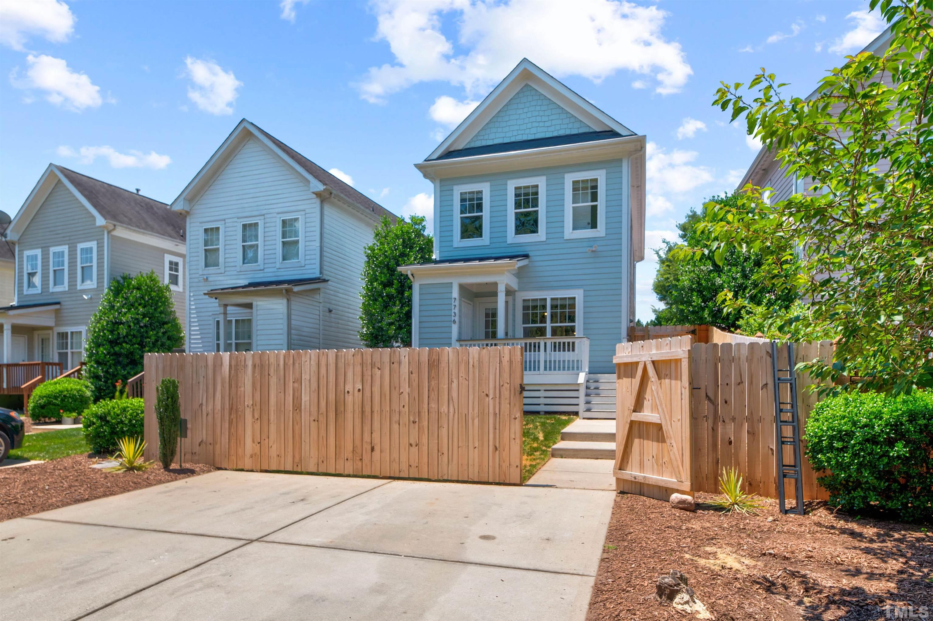 7736 ACC Boulevard Raleigh, NC 27617 - Photo 36 of 37 a view of house with wooden fence