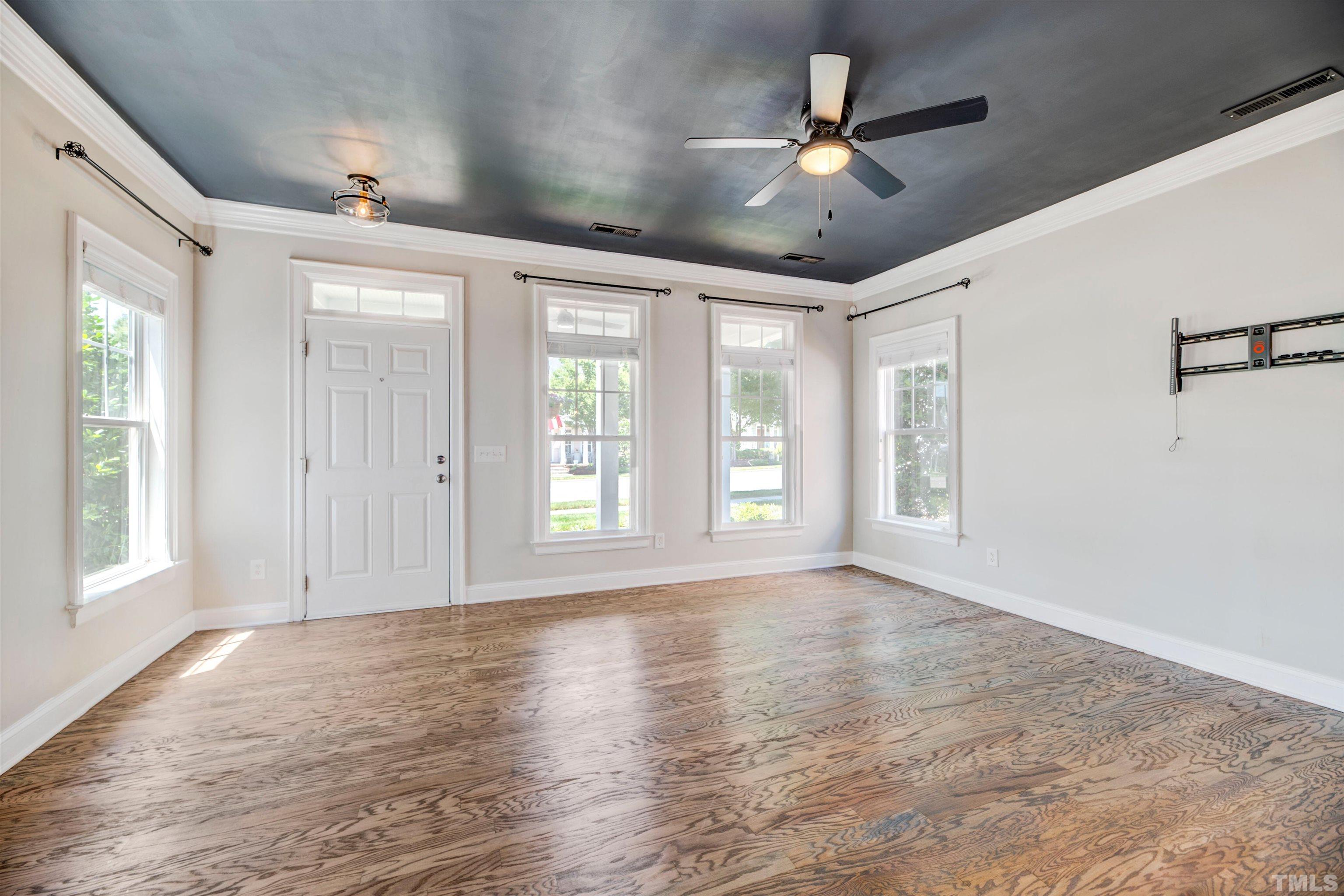 7736 ACC Boulevard Raleigh, NC 27617 - Photo 4 of 37 a view of an empty room with a window