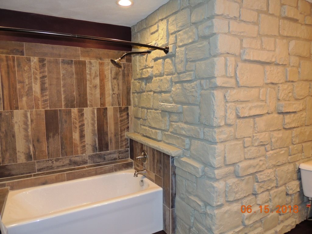 12294 County Line Road Roscoe, IL 61073 - Photo 17 of 25 a bathroom with a bathtub and shower