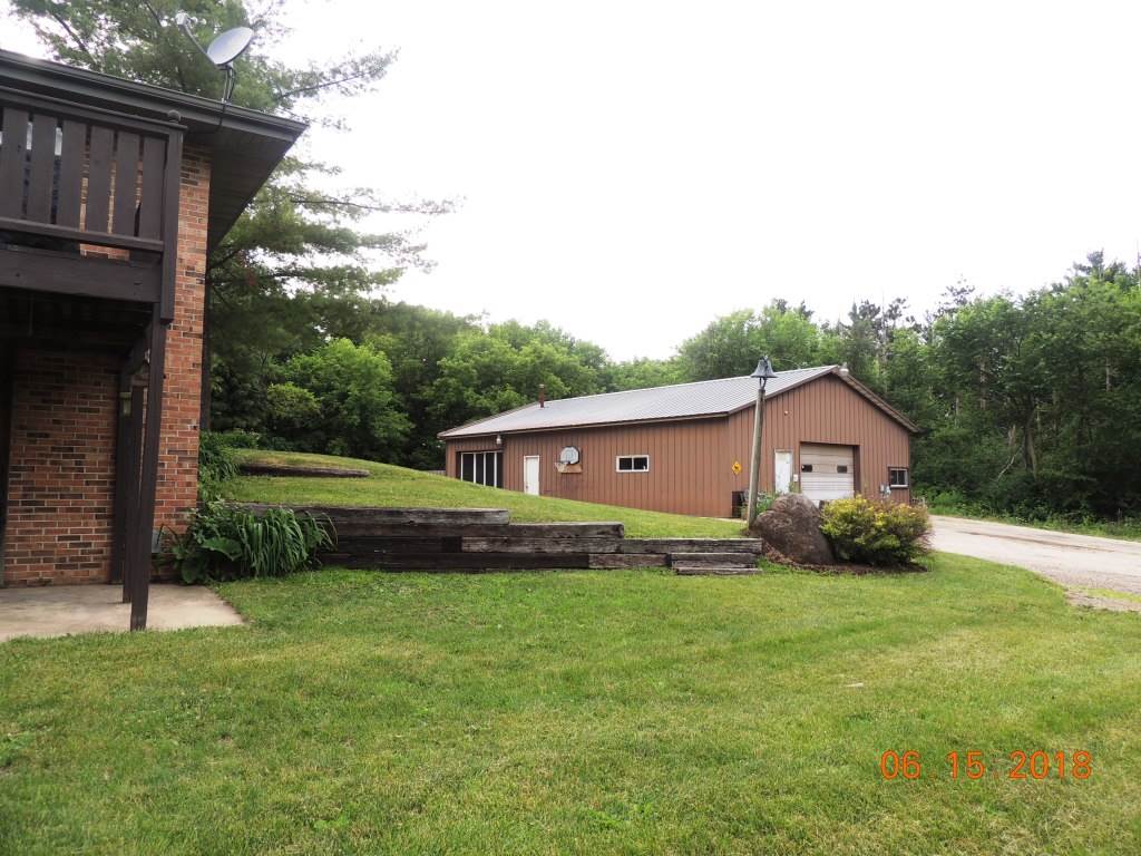 12294 County Line Road Roscoe, IL 61073 - Photo 21 of 25 a view of a house with a back yard