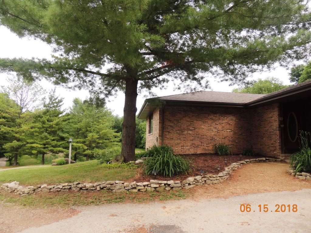 12294 County Line Road Roscoe, IL 61073 - Photo 4 of 25 a front view of a house with a yard