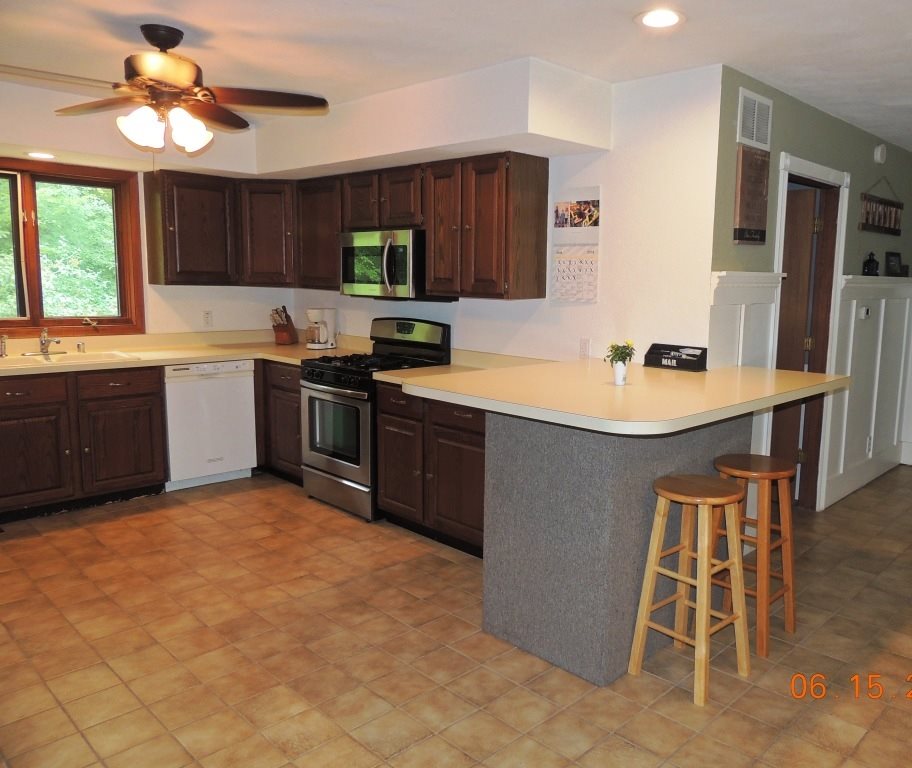 12294 County Line Road Roscoe, IL 61073 - Photo 8 of 25 a kitchen with a sink appliances and cabinets