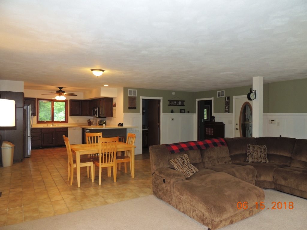 12294 County Line Road Roscoe, IL 61073 - Photo 9 of 25 a living room with furniture and a large window