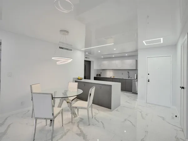 a kitchen with a sink cabinets and window