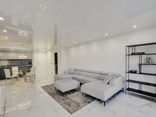 a living room with furniture and a rug