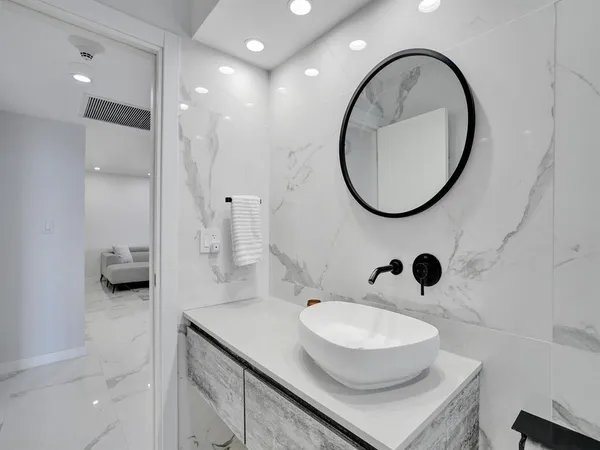 a bathroom with a sink and a mirror