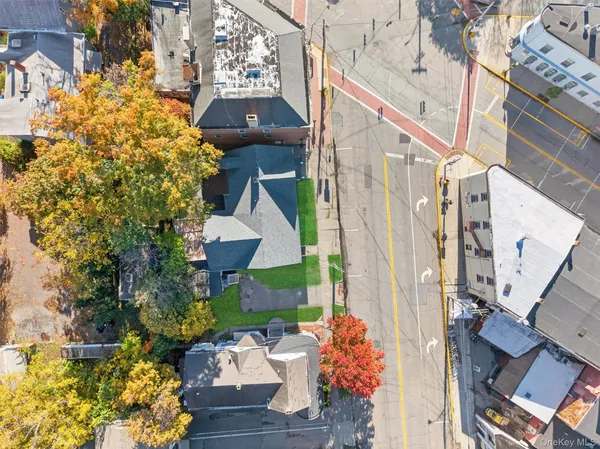 a view of a house with a yard and garden