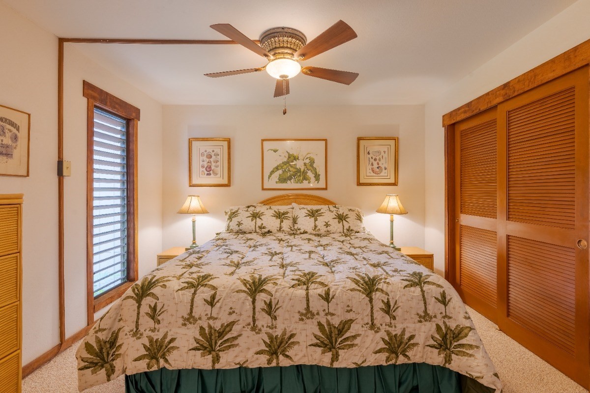 2721 Poipu Road, Unit 420 Koloa, HI 96756 - Photo 12 of 26 a bed sitting in a bedroom next to a window