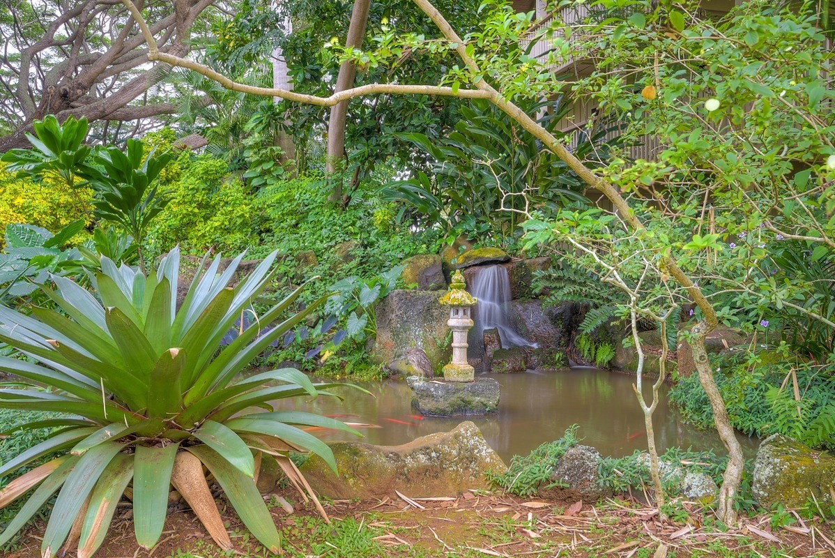 2721 Poipu Road, Unit 420 Koloa, HI 96756 - Photo 19 of 26 a backyard of a house with lots of green space