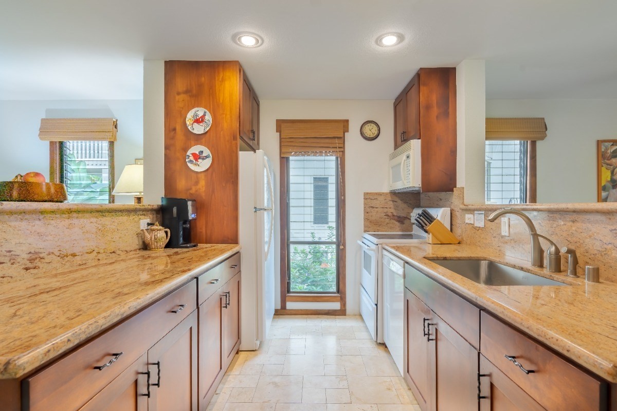 2721 Poipu Road, Unit 420 Koloa, HI 96756 - Photo 4 of 26 a spacious bathroom with a granite countertop sink and a large mirror