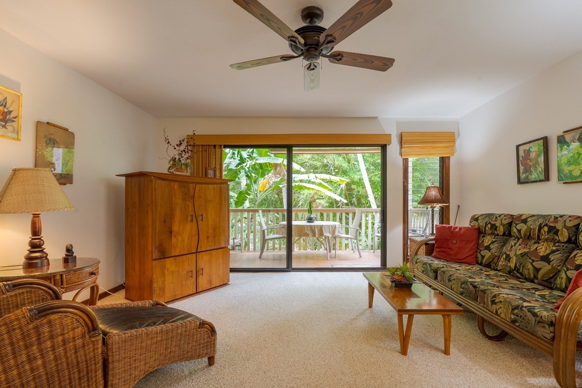 2721 Poipu Road, Unit 420 Koloa, HI 96756 - Photo 9 of 26 a living room with furniture and a large window