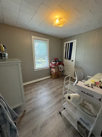 a bedroom with furniture and a window