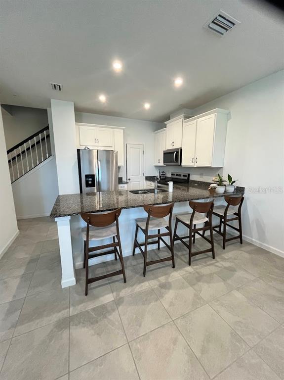 4208 Sadler Road Apopka, FL 32712 - Photo 4 of 7 a view of a dining room with furniture