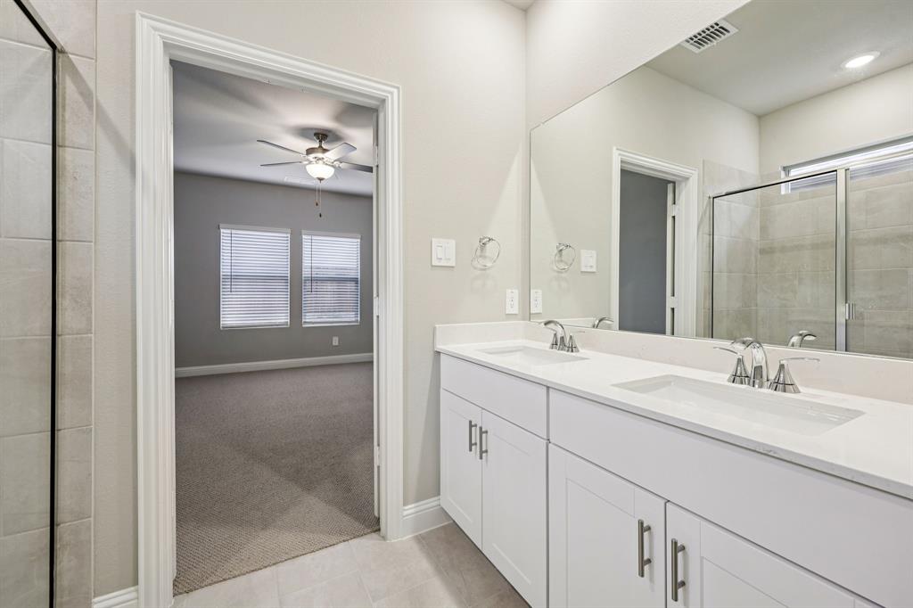 1721 Arches Road Anna, TX 75409 - Photo 26 of 39 a bathroom with double sink and a mirror
