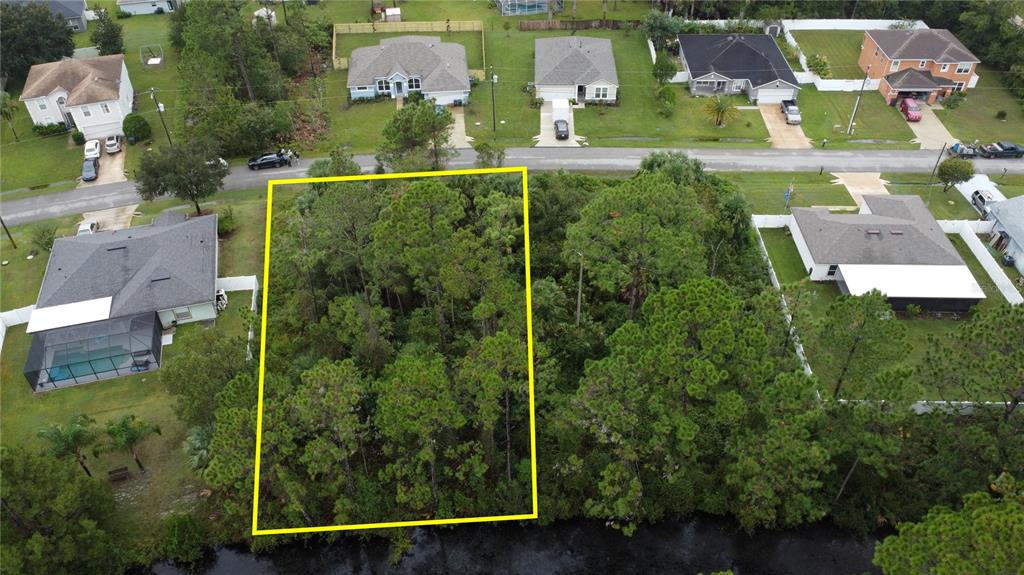 98 Sloganeer Trail Palm Coast, FL 32164 - Photo 3 of 7 an aerial view of residential houses with outdoor space and street view