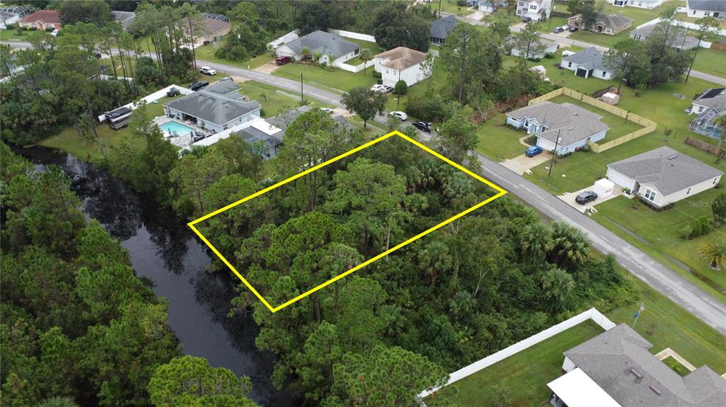 98 Sloganeer Trail Palm Coast, FL 32164 - Photo 4 of 7 an aerial view of a residential houses with outdoor space