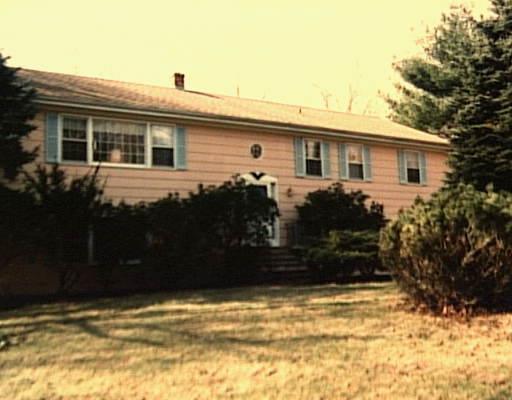41 Longmeadows Road Wilton, CT 06897 - Photo 1 of 1 a front view of a house with a yard