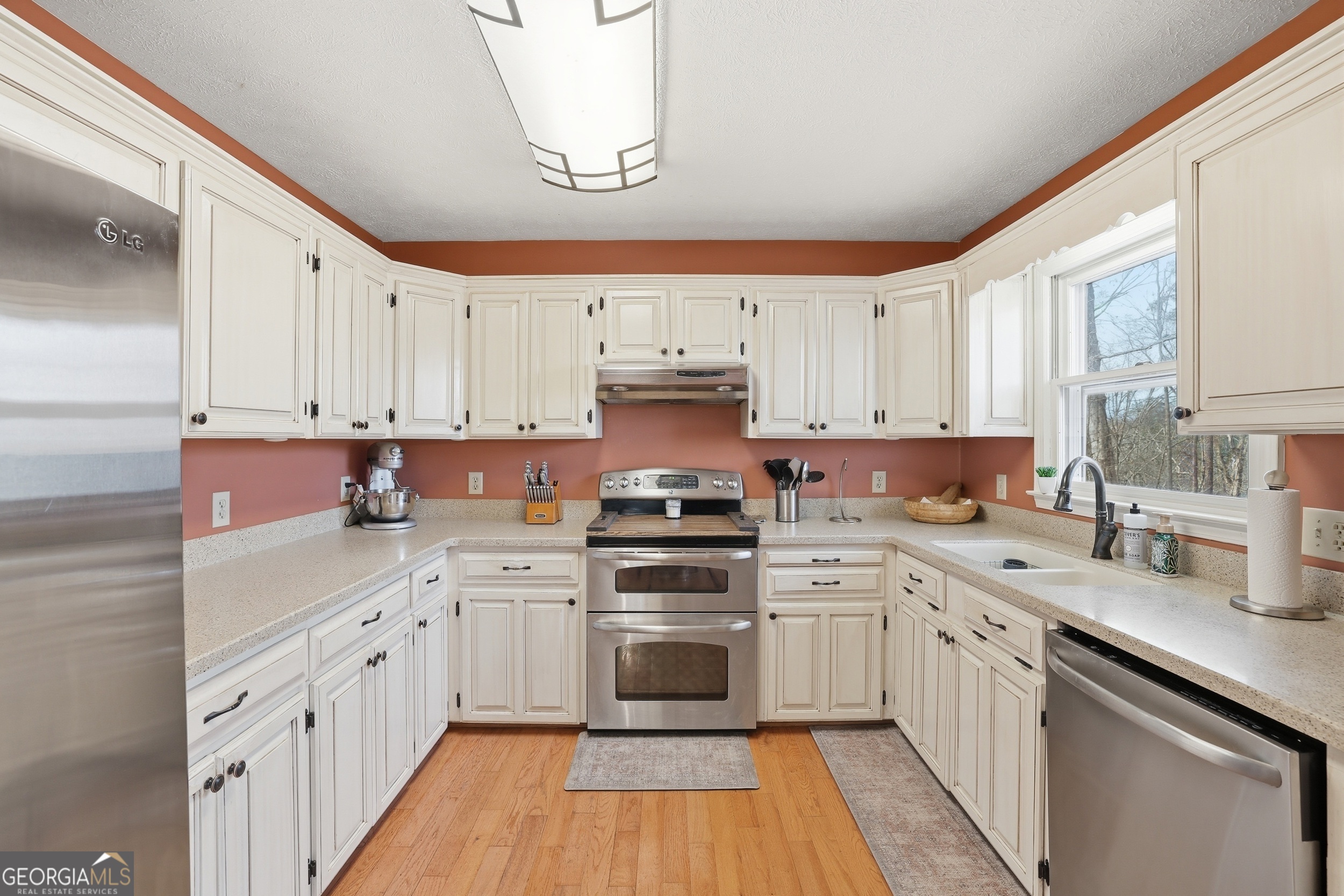 81 McMurray Road Toccoa, GA 30577 - Photo 19 of 50 a kitchen with cabinets stainless steel appliances and a window