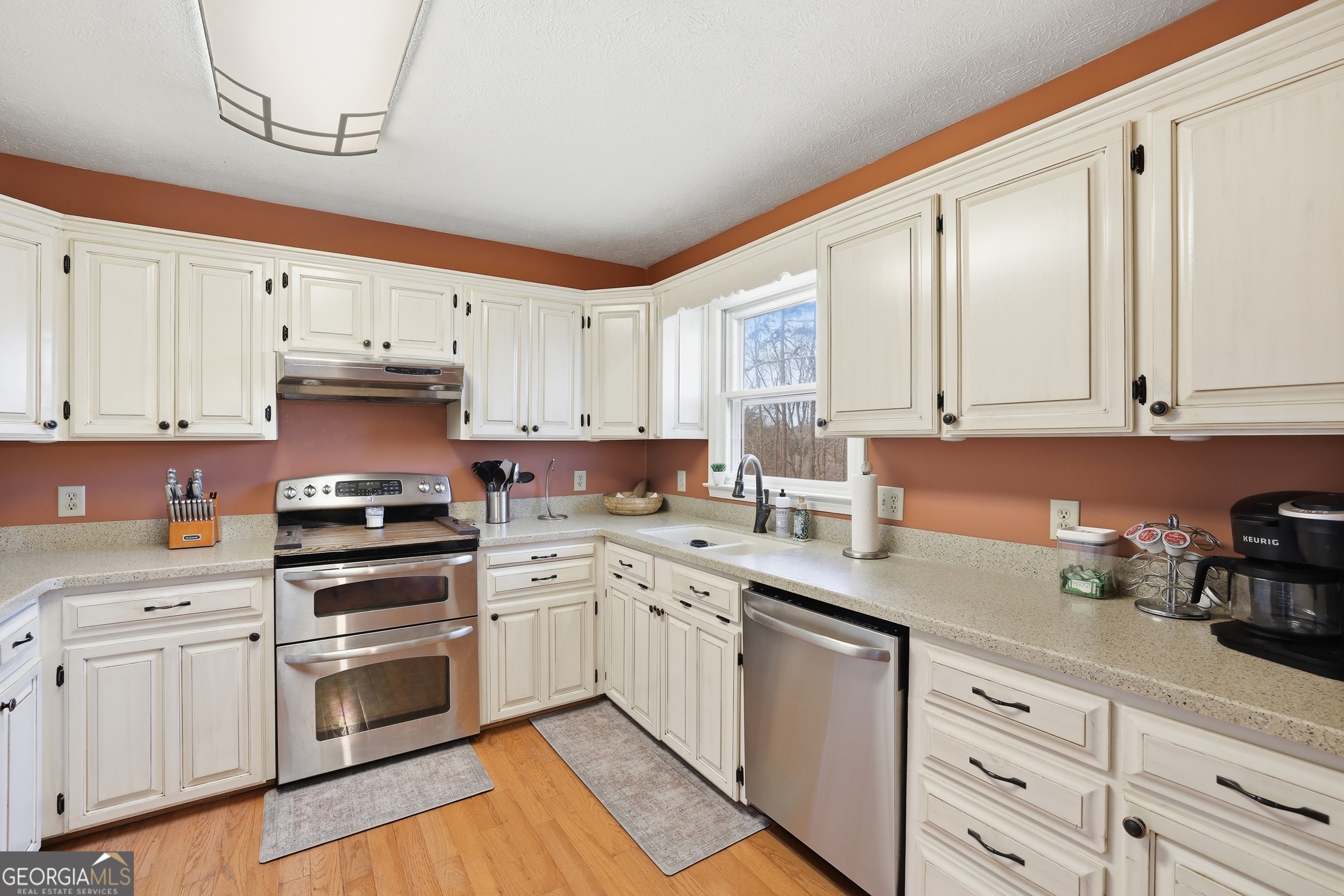 81 McMurray Road Toccoa, GA 30577 - Photo 20 of 50 a kitchen with granite countertop white cabinets and white appliances