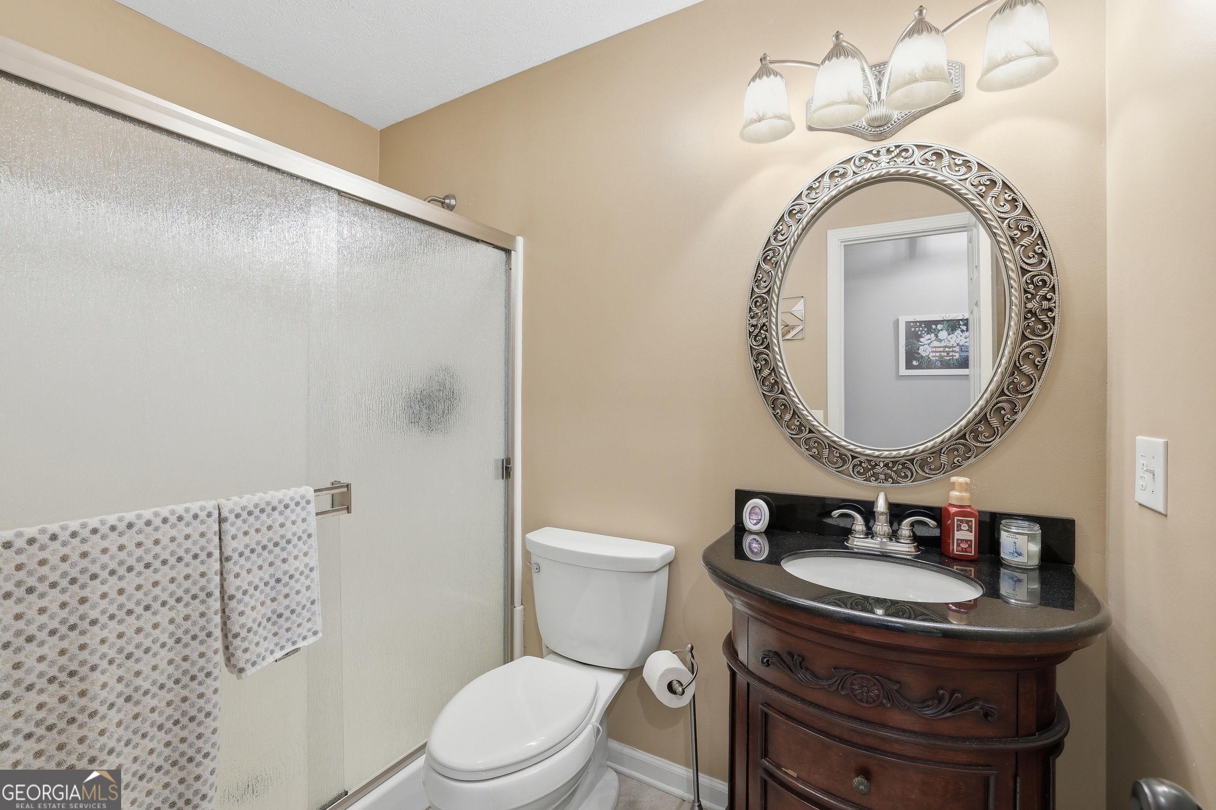 81 McMurray Road Toccoa, GA 30577 - Photo 23 of 50 a bathroom with a sink a toilet and a mirror