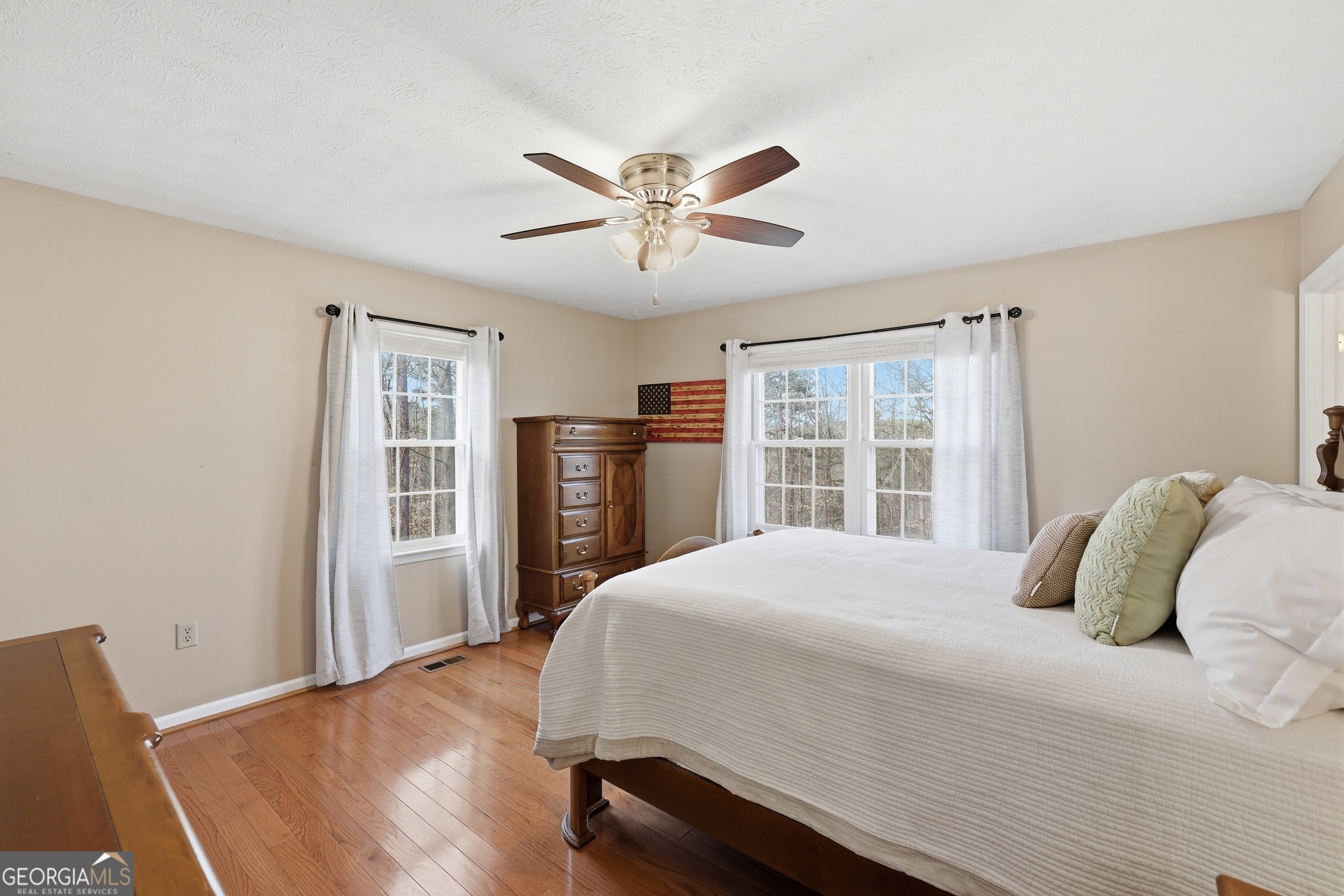81 McMurray Road Toccoa, GA 30577 - Photo 26 of 50 a bedroom with a large bed and a window