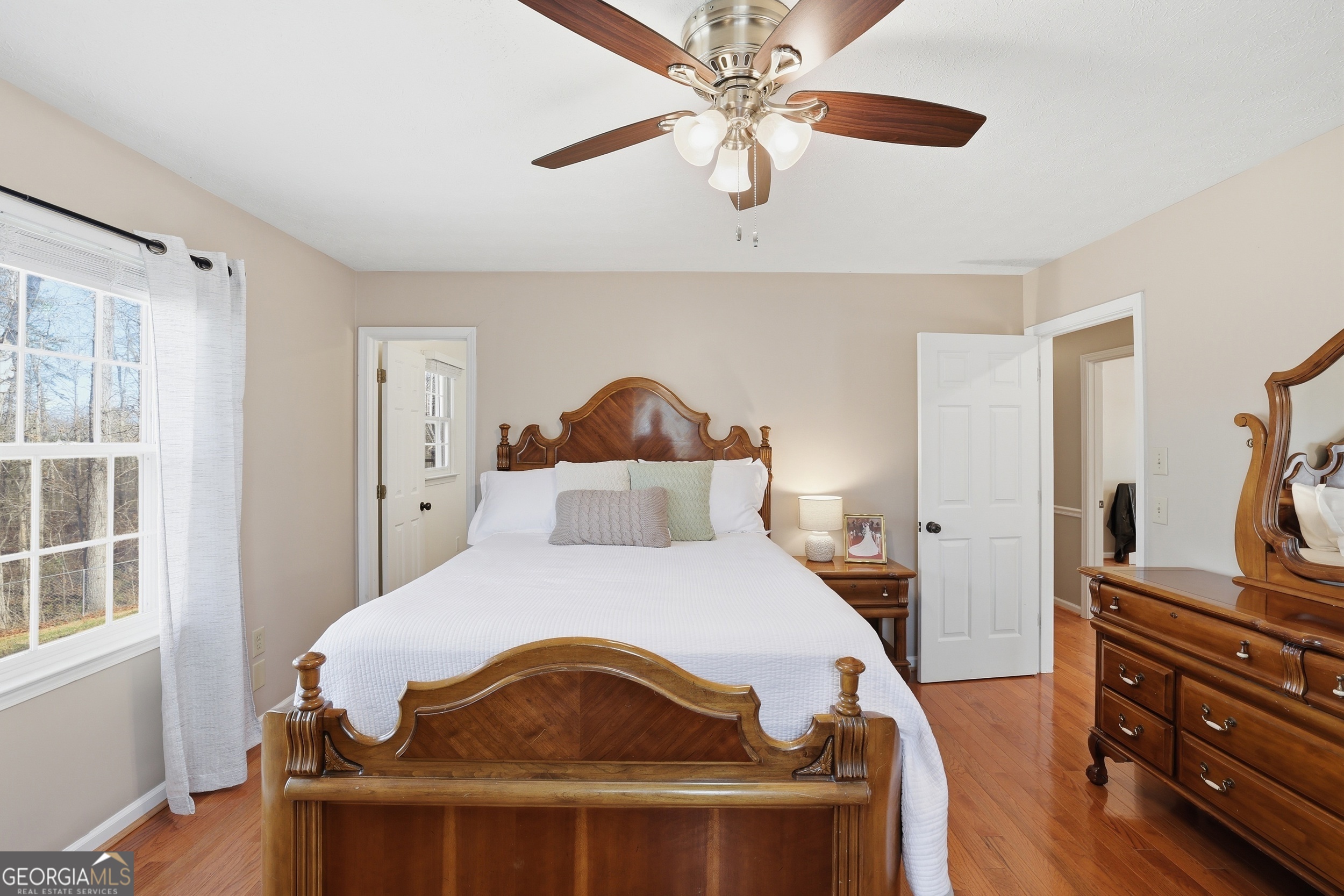 81 McMurray Road Toccoa, GA 30577 - Photo 27 of 50 a bedroom with a bed and wooden floor