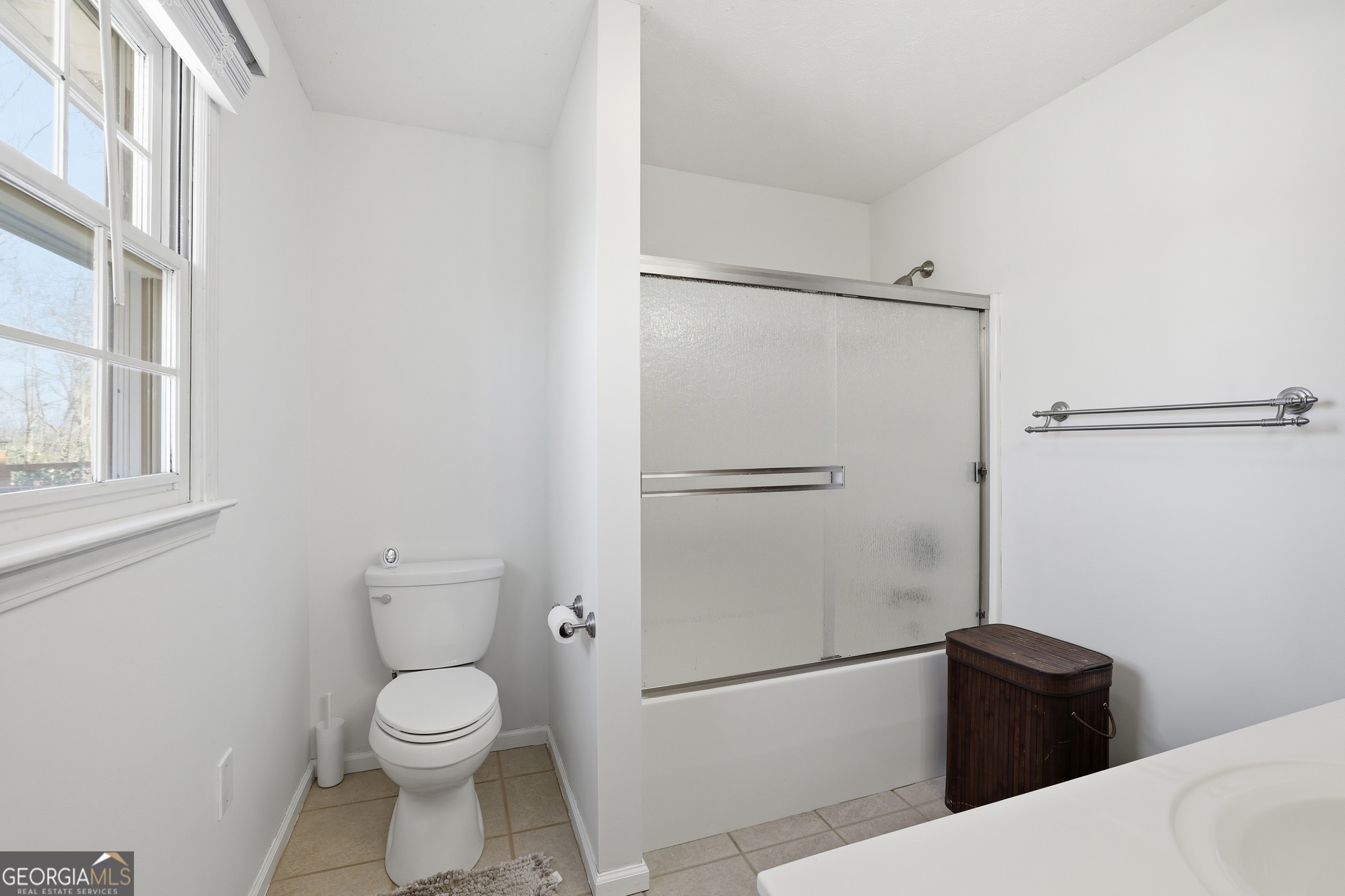 81 McMurray Road Toccoa, GA 30577 - Photo 28 of 50 a white toilet sitting next to a bathroom sink