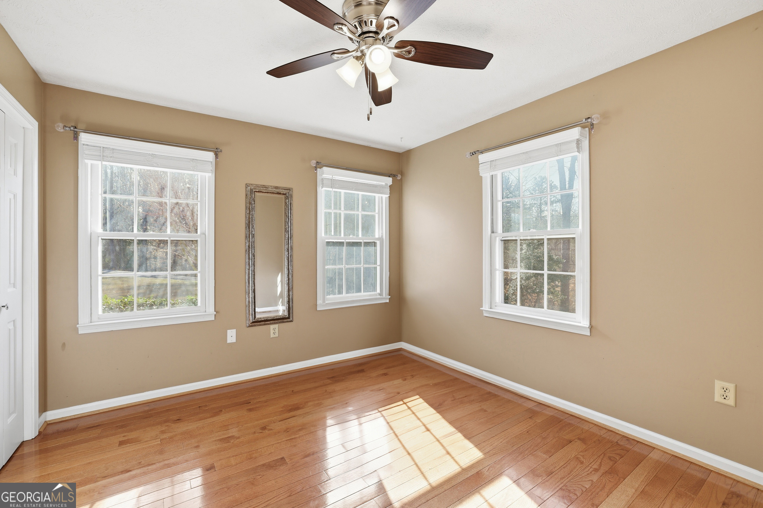 81 McMurray Road Toccoa, GA 30577 - Photo 30 of 50 a view of an empty room with a window and wooden floor