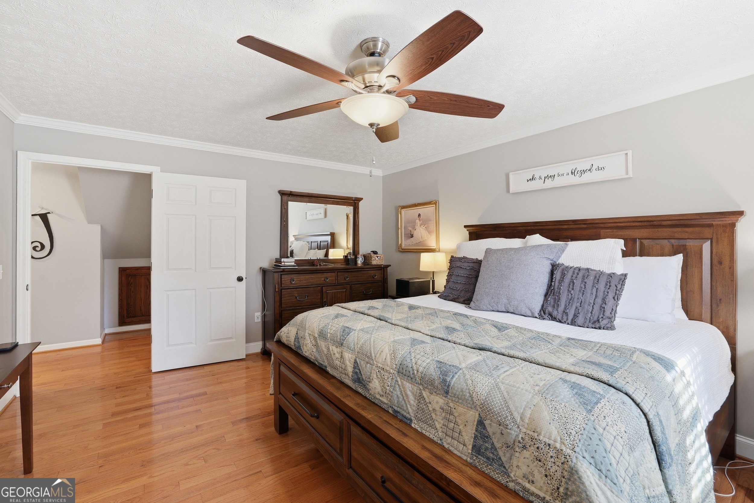 81 McMurray Road Toccoa, GA 30577 - Photo 33 of 50 a spacious bedroom with a bed and a chandelier