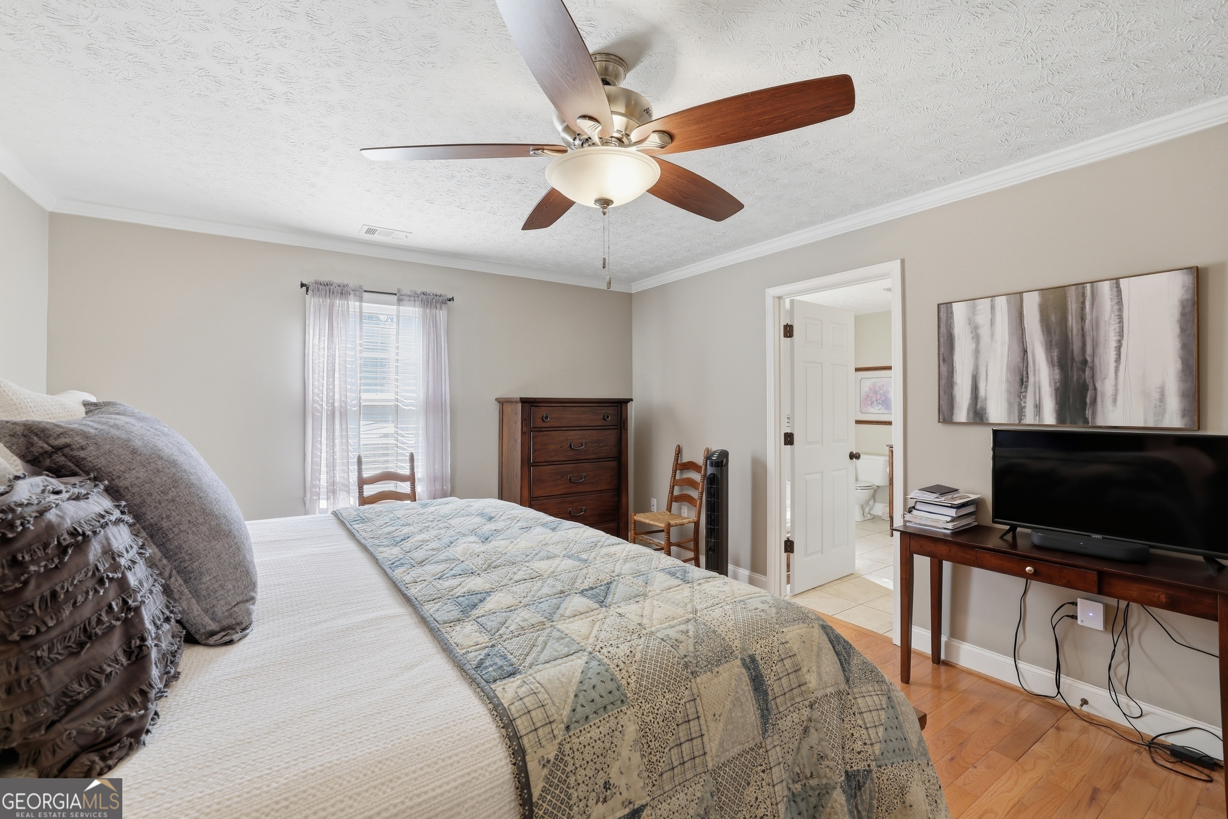 81 McMurray Road Toccoa, GA 30577 - Photo 34 of 50 a spacious bedroom with a bed and a flat screen tv