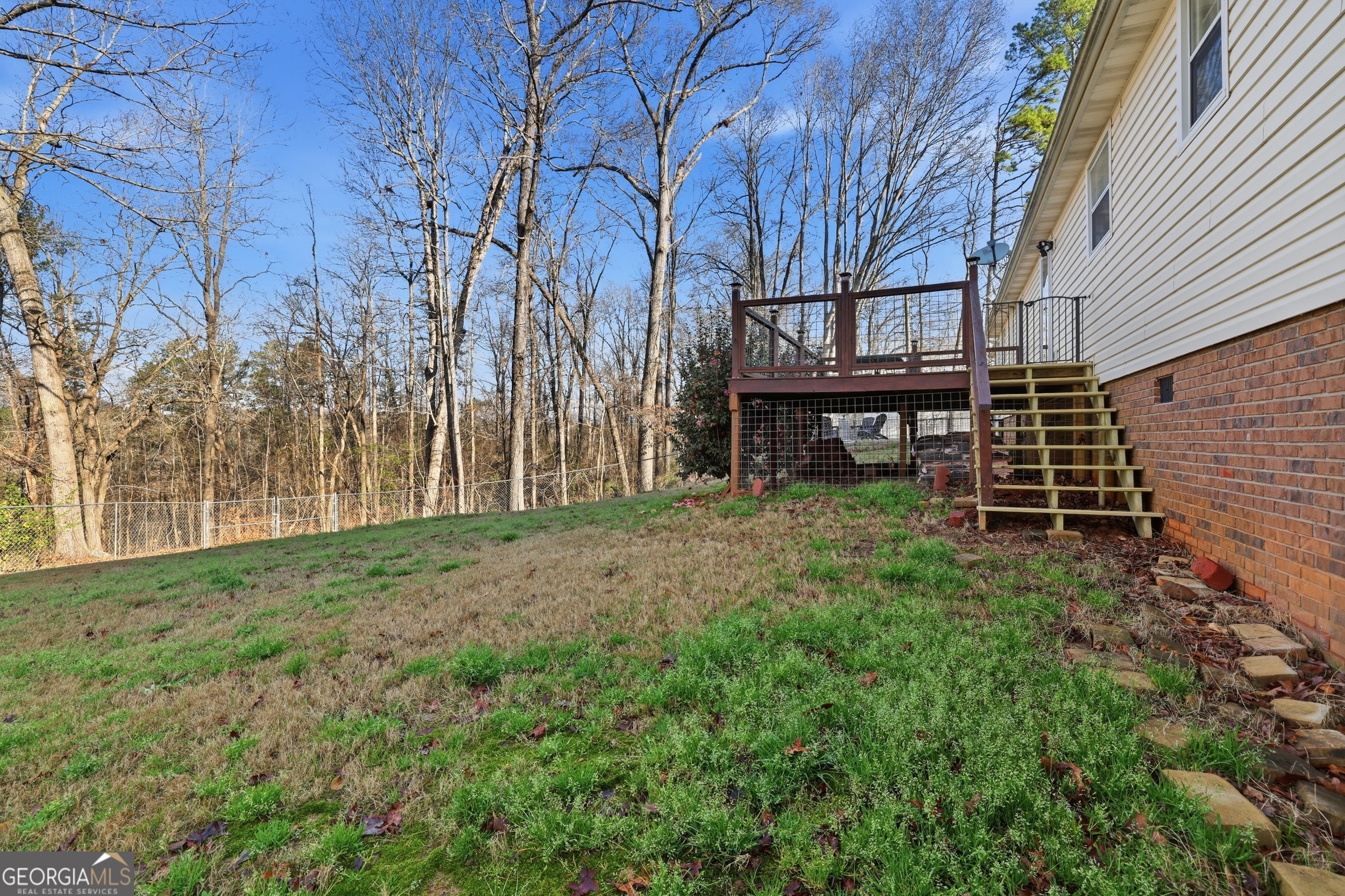 81 McMurray Road Toccoa, GA 30577 - Photo 10 of 50 a view of a backyard with wooden fence and large trees