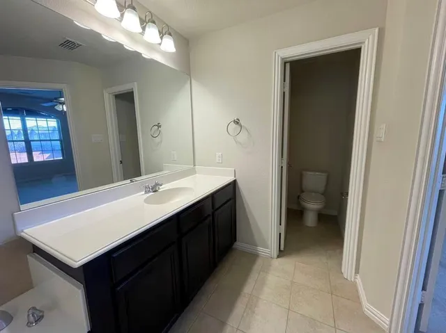 a bathroom with a shower and sink