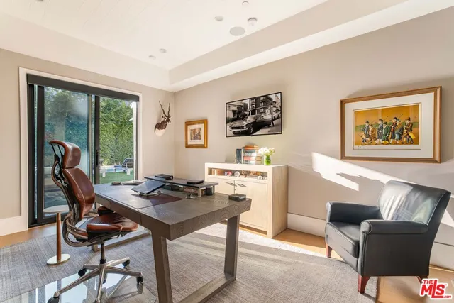 a workspace with furniture and window