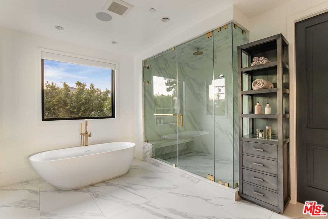 4533 Gentry Avenue Studio City, CA 91607 - Photo 20 of 39 a bathroom with a bathtub and a shower