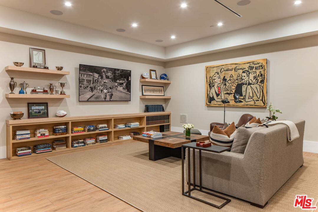 4533 Gentry Avenue Studio City, CA 91607 - Photo 31 of 39 a work room with furniture and paintings on the wall