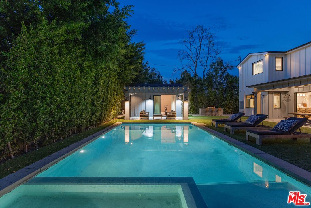 4533 Gentry Avenue Studio City, CA 91607 - Photo 36 of 39 a view of a swimming pool with a patio