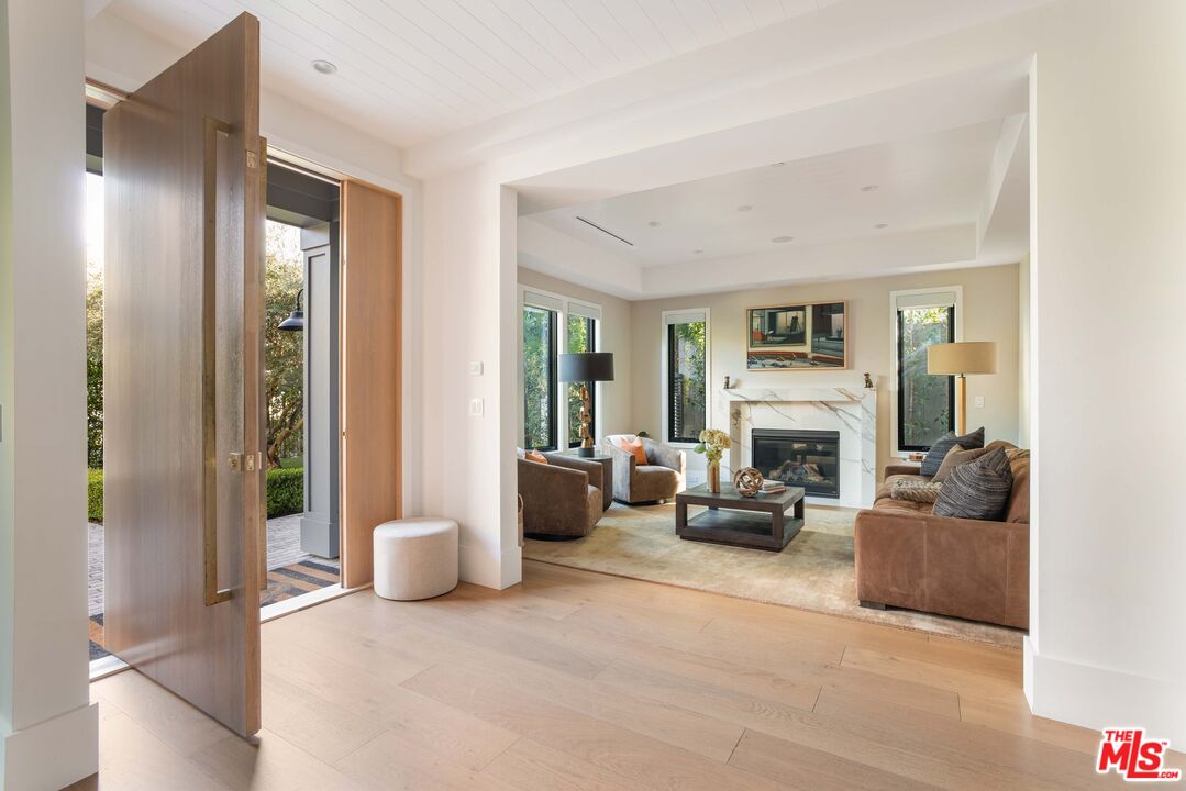 4533 Gentry Avenue Studio City, CA 91607 - Photo 4 of 39 a living room with furniture and a fireplace