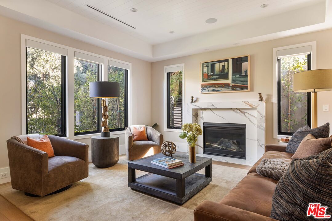 4533 Gentry Avenue Studio City, CA 91607 - Photo 5 of 39 a living room with furniture and a fireplace